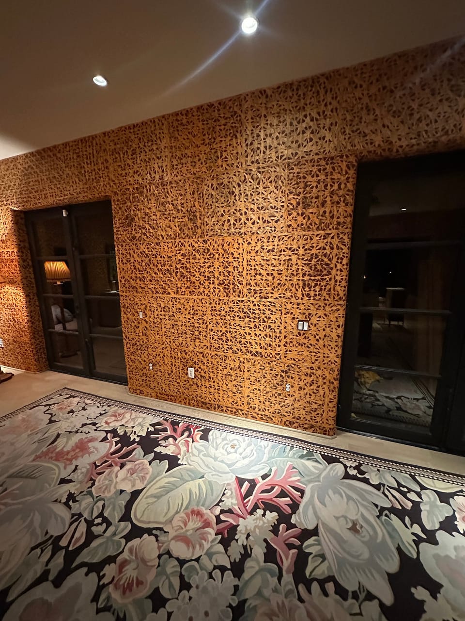 Barkskin wall beside a dark cabinet