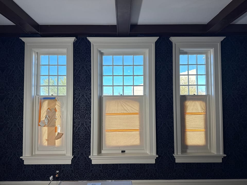 Blue damask around three windows