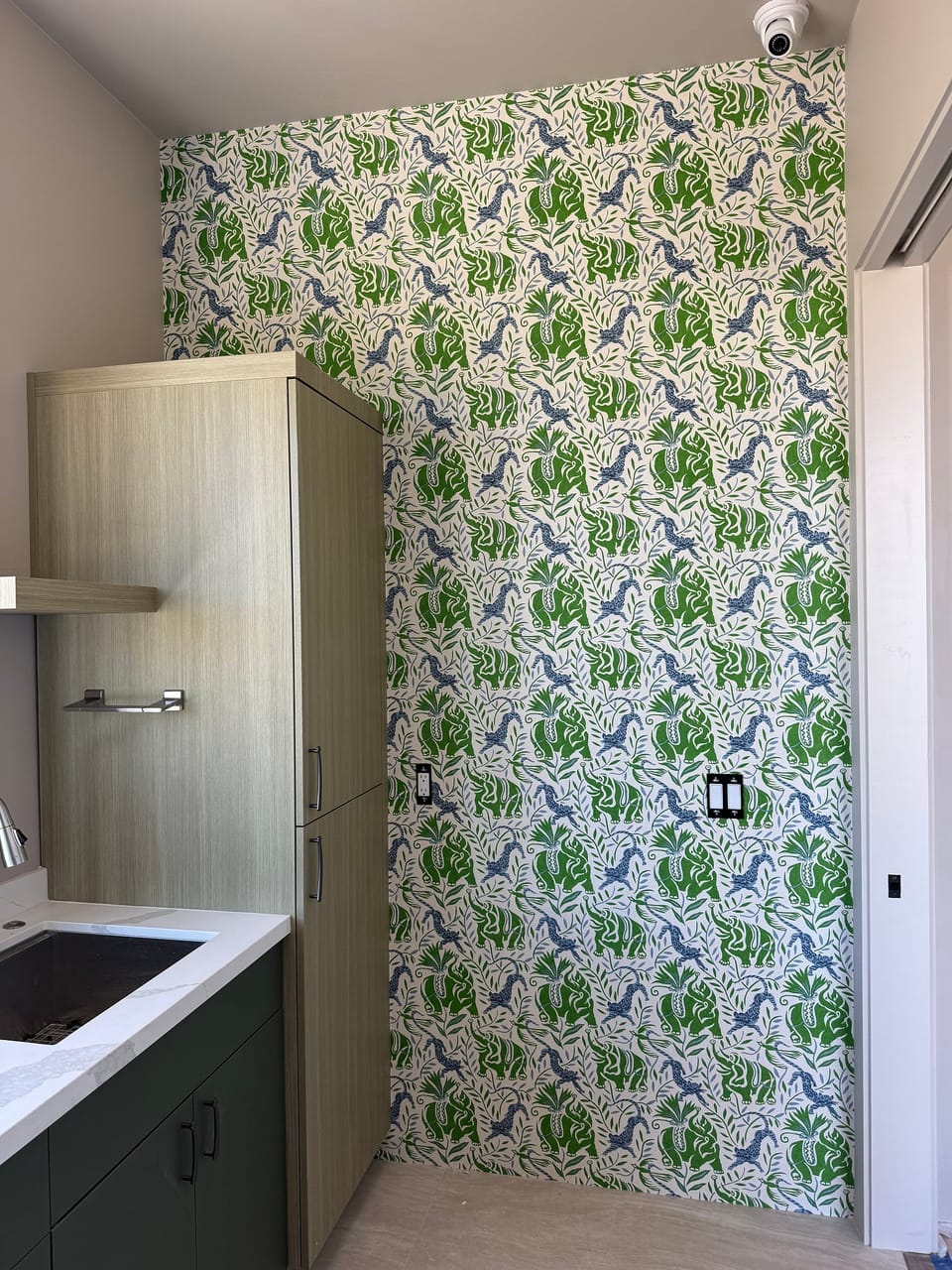 Christopher Farr pattern beside cabinets