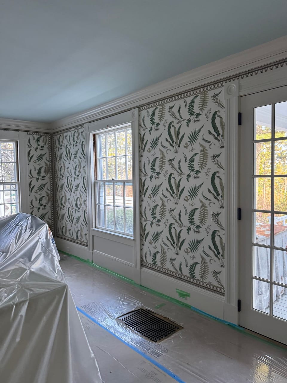 Fern pattern beside the windows and doors