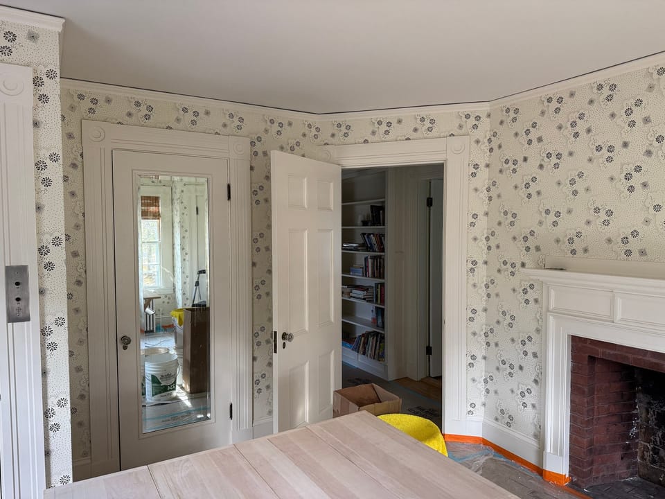 Floral print around the doors and fireplace