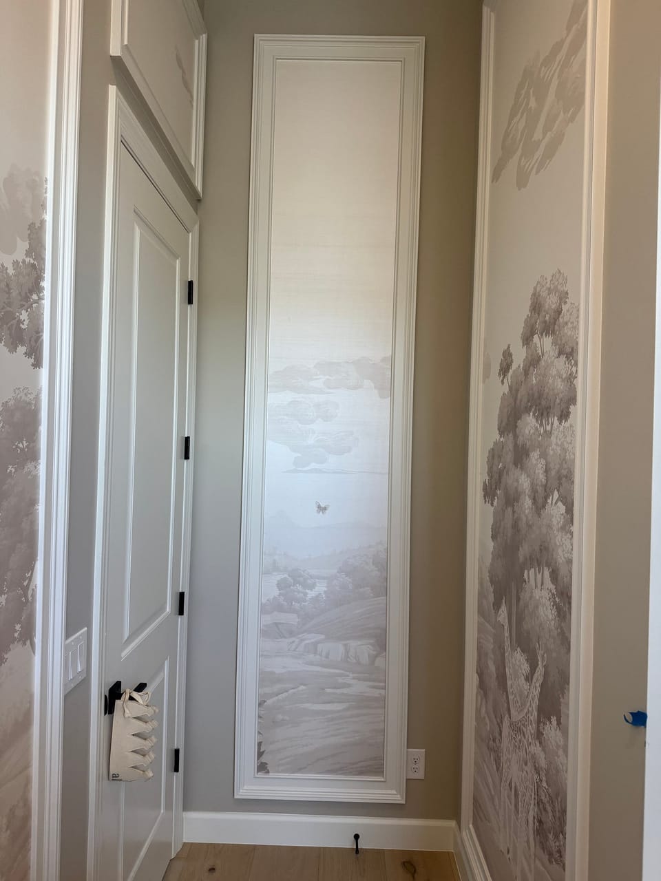 Fromental panel beside a door