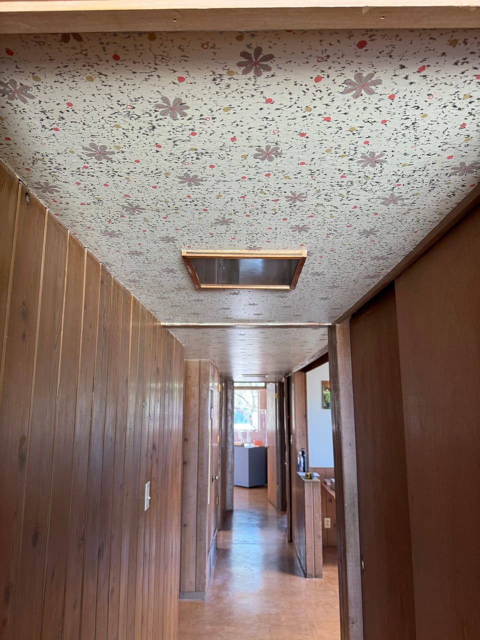 Hand-screened pattern on the hallway ceiling
