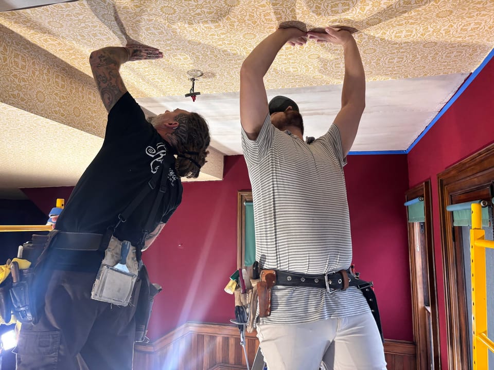 Hanging the new ceiling material overhead