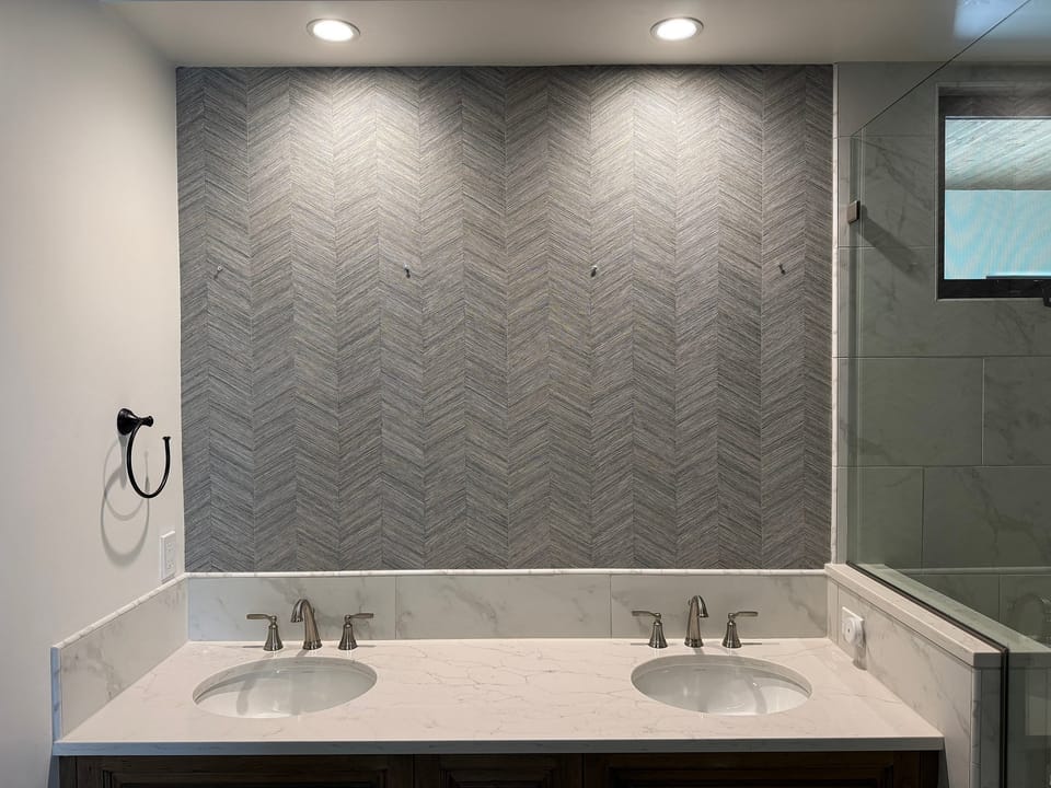 Herringbone pattern behind a double vanity