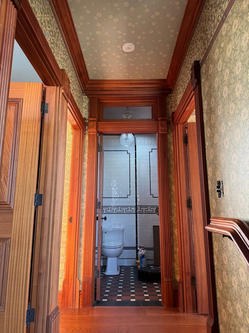 Patterned walls around a wood-framed doorway