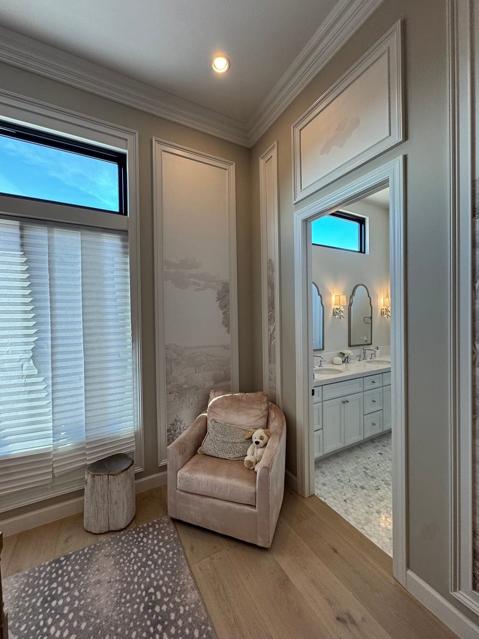 Picture-frame panels beside the bathroom door