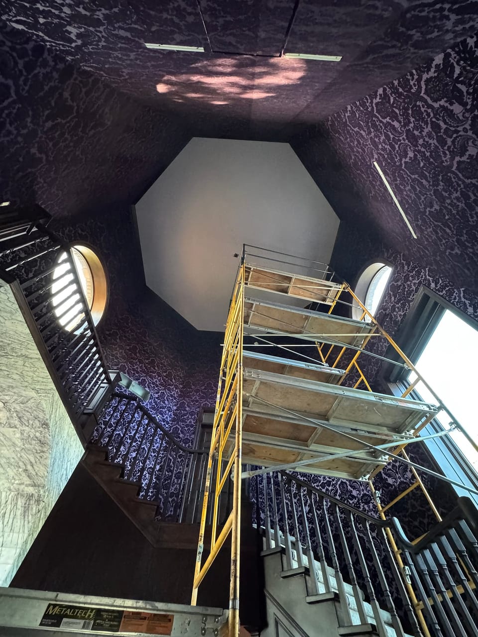 Scaffolding in the tall stairwell