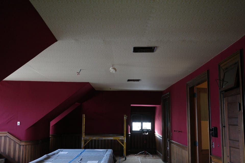 The third-floor room with the new ceiling in place
