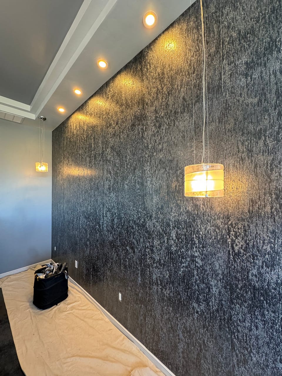 Vahallan wall under a pendant light