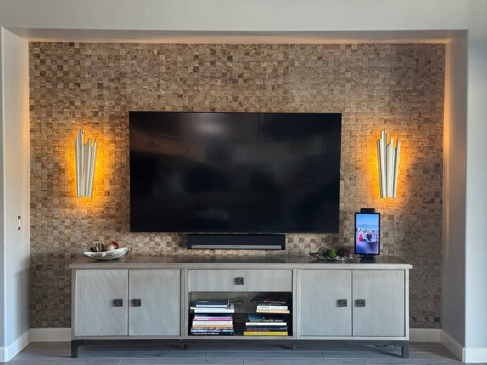 Woven wood wall behind the TV