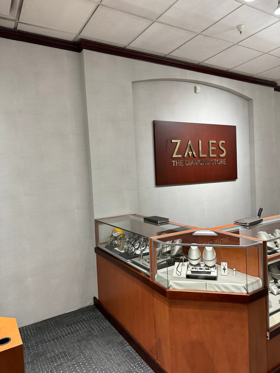 Zales store wall behind a display case
